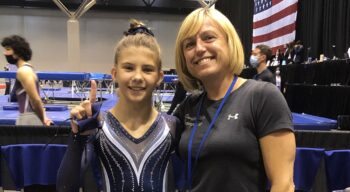 Coach Natasha and a gymnast.