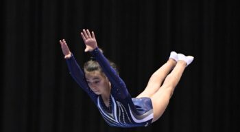 A girl in the air mid-flip.