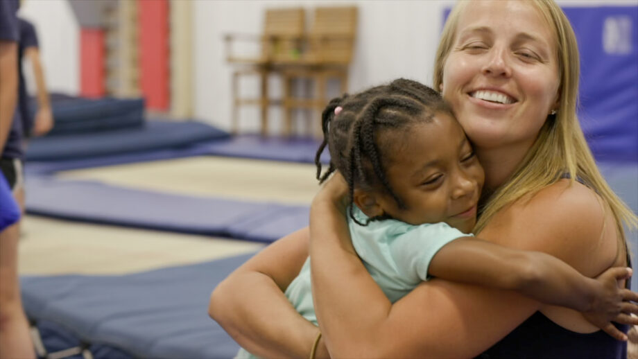 nastia and a girl hugging.