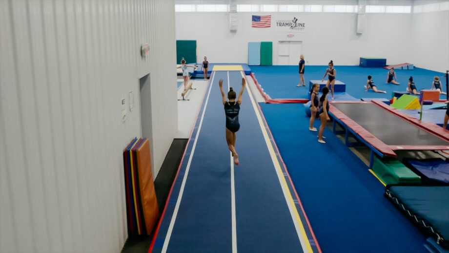 a girl running into a cartwheel.